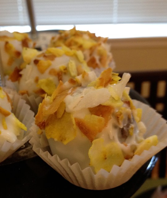 Banana cake with mascarpone white chocolate ganache, rolled in curried coconut.